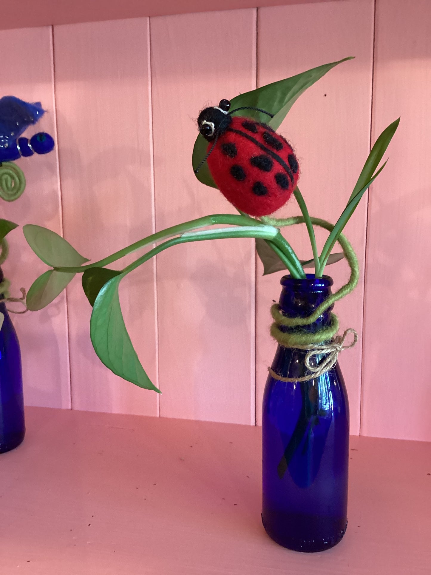 Ladybug Frond Friend on Blue Glass Bottle